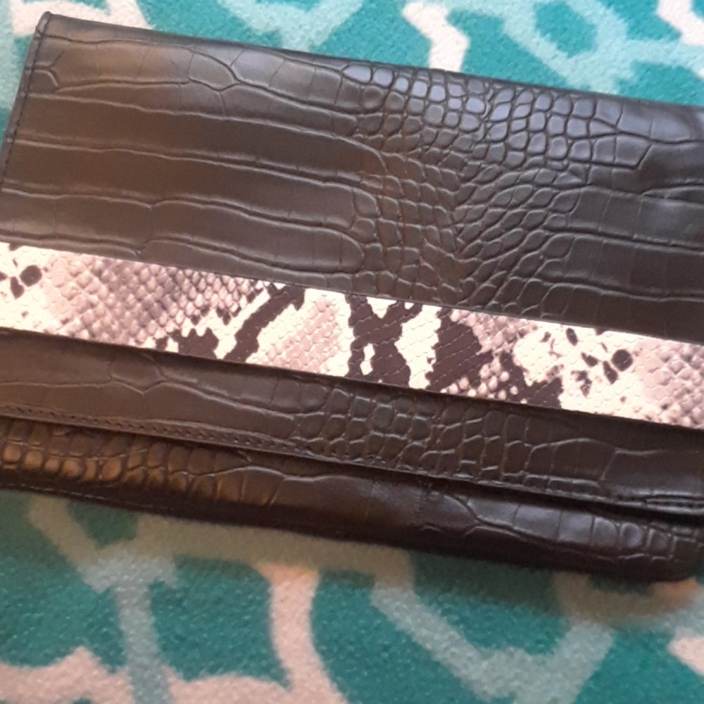 Brand new with tags. Snake print Clutch